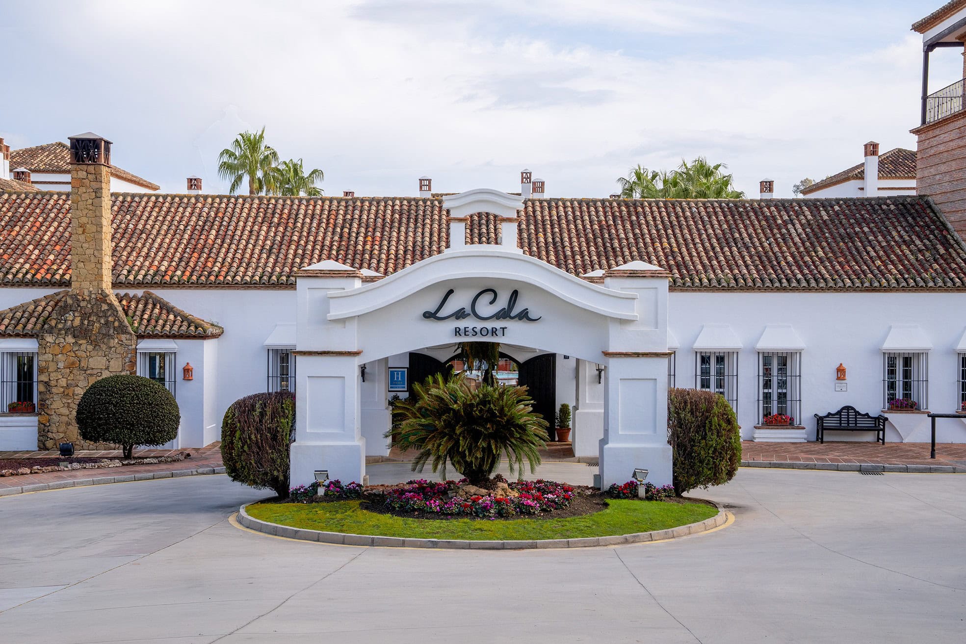 La Cala Resort Brand Photography – Luxury Hospitality Venue Spain | Silverscreen Film & Photography Entrance to La Cala Resort in Spain showing branded hotel architecture and landscaped forecourt