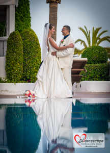A serene and romantic embrace by the pool as the bride and groom celebrate their Marbella wedding surrounded by lush greenery and Mediterranean palms.
© All Rights Reserved Dougie Farrelly Silverscreen.ie Romantic Poolside Wedding Moment in Marbella, Spain