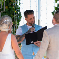 A magical moment unfolds at Cortijo Maria Luisa in Nerja, Spain, as the bride and groom, surrounded by loved ones, have singer Keith Duffy as their wedding celebrant. An intimate celebration filled with joy and music, beautifully captured by Dougie Farrelly, the esteemed Irish Celebrity Wedding Photographer for Cortijo Maria Luisa Weddings | Silverscreen Film & Photography Bride and groom exchanging vows with singer Keith Duffy as their wedding celebrant at the private villa Cortijo Maria Luisa in Nerja, Spain. Surrounded by family and friends, captured by Dougie Farrelly and the silverscreen.ie team, highly recommended Irish Celebrity Wedding Photographer for Cortijo Maria Luisa Weddings.