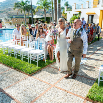 Rachel Smyth walks up the aisle with her father at her wedding with George McMahon's Nerja Wedding Spain celebrating Pic: Dougie Farrelly, Silverscreen.ie Rachel Smyth walks up the aisle with her father at her wedding with George McMahon's Nerja Wedding Spain celebrating Pic: Dougie Farrelly, Silverscreen.ie