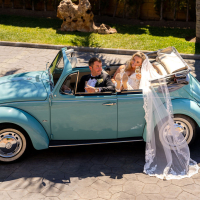The newlyweds are seen <strong>toasting champagne</strong>, just before they are announced into their wedding reception at the private villa "Cortijo Maria Luisa in Nerja Spain A bride in a white wedding gown and veil sits drinking champagne in the back seat of a vintage Volkswagen Beetle, while the groom, dressed in black tie, joins in the celebrations drinking champagne sitting in the front seat of the car